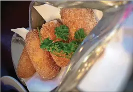  ?? LIZ BALMASEDA / THE PALM BEACH POST ?? Bar favorite: a hot batch of ham croquetas at Tapeo Spanish restaurant in downtown West Palm Beach.