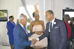  ??  ?? Media personalit­y and diamond Mile fashion ambassador Terrikarel­le Reid introduced diamond Mile best-dressed male winner Linton Johnson (right), supply chain manager, Nestlé Jamaica, to dennis Lalor, chairman and CEO, ICWI Group Limited.