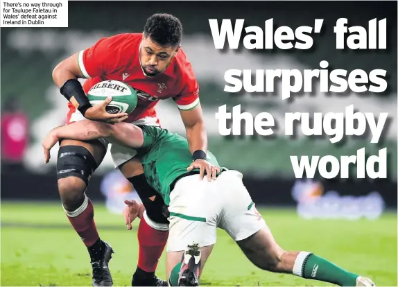  ??  ?? There’s no way through for Taulupe Faletau in Wales’ defeat against Ireland in Dublin