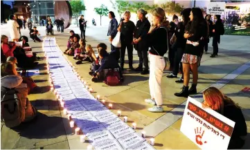  ?? — AFP photo ?? Israeli women attend a rally against domestic violence in the Israeli coastal city of Tel Aviv.