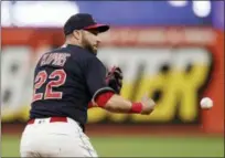  ?? TONY DEJAK — THE ASSOCIATED PRESS ?? The Indians’ Jason Kipnis bobbles the ball in the seventh inning against the Reds on July 9 at Progressiv­e Field. Jose Peraza grounded into a fielder’s choice and was safe at first base. Scott Schebler was safe at second base on Kipnis’ error.