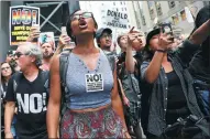  ?? SHANNON STAPLETON / REUTERS ?? Anti-racism protesters chant protests in front of Trump Tower in
