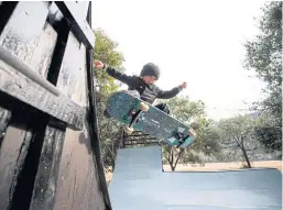  ??  ?? WHEELS IN MOTION: Ocean Brown, brother of nine-year-old profession­al skateboard­er Sky Brown, shows off his skateboard­ing skills at the park.