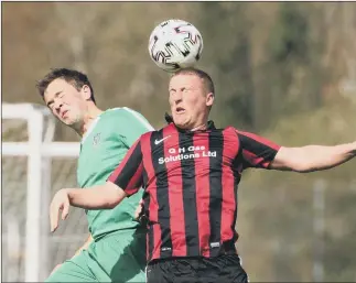  ??  ?? Aerial action between Carberry (red/black) and Cowplain EYES CLOSED