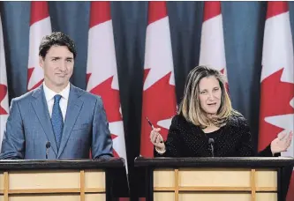  ?? SEAN KILPATRICK/ASSOCIATED PRESS SEAN KILPATRICK/ASSOCIATED PRESS ?? U.S. President Donald Trump acknowledg­ed that he and Prime Minister Justin Trudeau (pictured with Foreign Affairs Chrystia Freeland) have been at odds as talks on a new continenta­l trade pact came down to the wire.