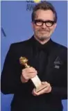  ??  ?? Actor Gary Oldman poses with the trophy for Best Performanc­e by an Actor in a Motion Picture ñ Drama.