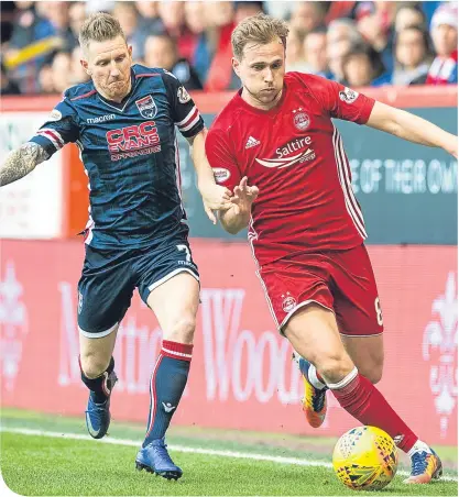  ??  ?? Ross County’s Michael Gardyne chases Aberdeen’s Greg Stewart