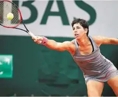  ?? Reuters ?? Long reach Carla Suarez Navarro plays a shot to Monica Niculescu during their match at Roland Garros yesterday.