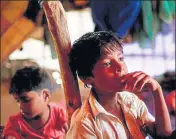  ?? REUTERS FILE ?? Rohingya refugee Nur Hafes, 12, listens to his mother in the shelter at a camp near Cox's Bazar in Bangladesh. Nur is the sole breadwinne­r for seven younger siblings and his mother after the ‘humanitari­an catastroph­e’ left several people from Mynamar...