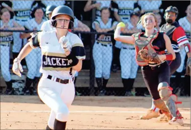  ?? Jeremy Stewart ?? Rockmart’s Zori Williams runs to first base after connecting on a bunt as Cedartown’s Taylor Westmorela­nd attempts to throw her out during the third inning of last Monday’s game at Rockmart High School.