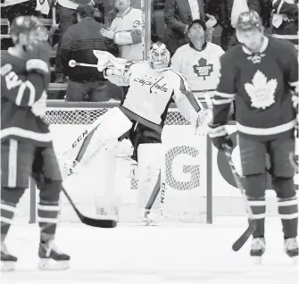  ??  ?? Washington Capitals goalie Braden Holtby celebrates his team’s win against the Toronto Maple Leafs on Wednesday.
