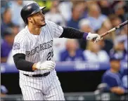  ?? DAVID ZALUBOWSKI / AP 2018 ?? Colorado third baseman Nolan Arenado signed an 8-year, $260M contract with the Rockies before the 2019 season. Arenado has expressed frustratio­n with the team, but says he never requested a trade.