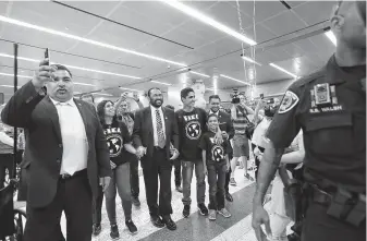  ?? Photos by Marie D. De Jesús / Staff photograph­er ?? After two years in El Salvador, Jose Escobar, center right, arrives in Houston with a visa in hand, flanked by his son Walter, 9, Rep. Al Green, center, his wife, Rose, and FIEL’s Cesar Espinosa, right.