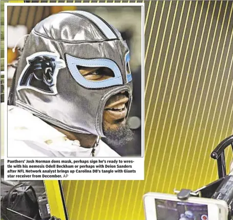  ?? AP ?? Panthers’ Josh Norman dons mask, perhaps sign he’s ready to wrestle with his nemesis Odell Beckham or perhaps with Deion Sanders after NFL Network analyst brings up Carolina DB’s tangle with Giants star receiver from December.