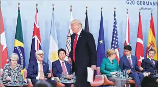  ?? PHOTO: REUTERS ?? US President Donald Trump along with other world leaders at a panel discussion on the second day of the G20 Summit in Hamburg, Germany on Saturday