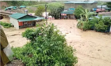  ?? — Reuters photo ?? Submerged houses damaged by landslide and floods are seen in Lai Chau province, Vietnam.