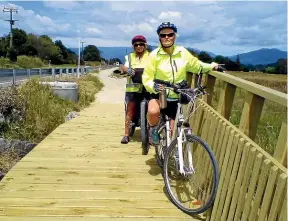  ?? PHOTOS: OLGA ALTMAN ?? Jane Baird and Debby Rogers on a section of the cycleway connecting Pohara and Takaka. Just over 50 per cent of the project has been finished.