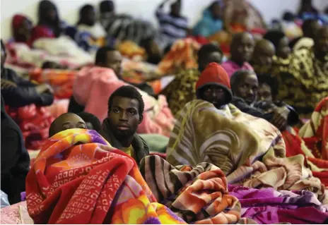  ?? AFP ?? African migrants in the overcrowde­d Tariq Al Matar detention centre on the outskirts of the Libyan capital Tripoli