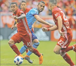  ?? AP ?? HAVING A BALL: The Red Bulls’ Kaku, who had a goal and two assists, moves the ball upfield against NYCFC in his team’s 4-0 Hudson River Derby victory on Saturday.