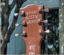  ?? WITOLD SKRYPCZAK/LONELY PLANET IMAGE ?? The city’s unofficial motto, “Keep Austin Weird,” is written on a guitar sculpture on Congress Avenue.