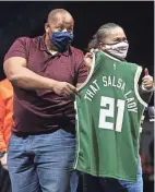  ??  ?? Nimrod Allen III, left, business adviser, and Angela Moragne, owner of That Salsa Lady, are recognized at the Back2Busin­ess event at Fiserv Forum on Monday.