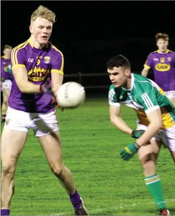  ??  ?? Midfielder Paddy Devereux delivers a handpass in Wednesday’s defeat to Offaly in Gracefield.