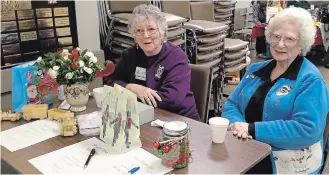  ?? SPECIAL TO THE EXAMINER ?? Lionesses Joan Jones and Bernice Cote welcomed shoppers at last year’s Christmas Vendors Show. This year’s fundraiser takes place Saturday.