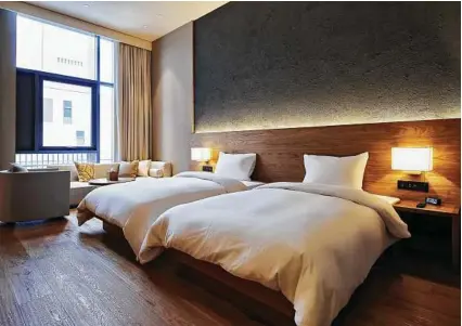  ?? MUJI / NYT ?? Furniture retailers, fitness clubs and film companies all have made forays into the hospitalit­y industry. “The hotel business is becoming a lifestyle business,” one expert said.