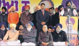  ??  ?? ■ (Front row) Former CM Parkash Singh Badal (second from left) and SAD president Sukhbir Singh Badal (right) look on as former minister Bikram Singh Majithia addresses the gathering during a party rally in Muktsar on Monday. SANJEEV KUMAR/HT
