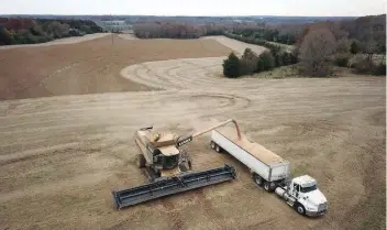  ?? — Reuters ?? A farmer harvests a crop of soybeans at a farm in Hickory, North Carolina, US.