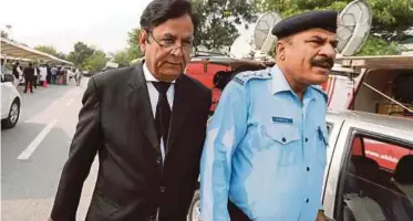  ?? REUTERS PIC ?? Saiful Mulook (left) leaving the court in Islamabad after condemned Christian woman Asia Bibi was spared from the gallows on Wednesday.