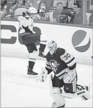  ?? Associated Press photo ?? Washington Capitals' Evgeny Kuznetsov, left, celebrates his game-winning goal as Pittsburgh Penguins goaltender Matt Murray skates to his bench during the overtime period in Game 6 of an NHL second-round hockey playoff series in Pittsburgh, Monday.