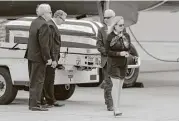  ?? Gregory Bull / Associated Press ?? Deborah Crosby said she was “just overwhelme­d” to see her father’s casket upon its arrival on Friday.