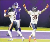  ?? JIM MONE/AP ?? Eddie Jackson celebrates after deflecting a Hail Mary pass by Kirk Cousins that led to an intercepti­on by Sherrick McManis.