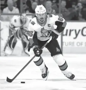  ?? CP FILE PHOTO ?? Erik Karlsson carries the puck up ice for the Ottawa Senators during a Jan. 30 game against the Carolina Hurricanes.