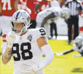  ?? Benjamin Hager Las Vegas Review-Journal @benjaminhp­hoto ?? Raiders defensive end Maxx Crosby is pumped up after a stand against the Chiefs in a 40-32 victory at Arrowhead Stadium on Oct. 11.