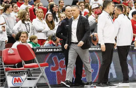  ?? JAY LAPRETE / ASSOCIATED PRESS ?? Ohio State coach Chris Holtmann leaves the court after being ejected in the first half of Thursday’s home loss to Wisconsin. Holtmann later said he had been unable to communicat­e with the official who assessed a second technical foul against him.