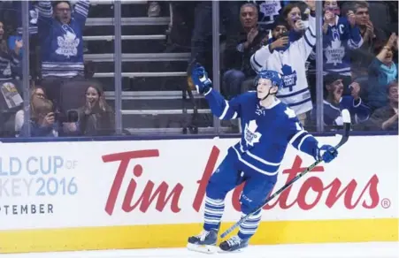  ?? NATHAN DENETTE/THE CANADIAN PRESS ?? Leafs winger Nikita Soshnikov celebrates scoring the game-winning goal in the shootout against the Islanders at the ACC on Wednesday night.