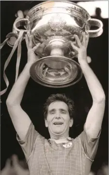  ??  ?? Meath captain Joe Cassells hoists the new Sam Maguire following the victory over Cork in 1988.