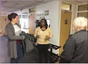  ?? EVAN BRANDT — MEDIANEWS GROUP ?? Jocelyn Charles, center, the new director of the Ricketts Community Center, gave a tour of the center during an open house in February, before COVID-19forced the closing of much of the center.