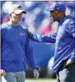  ?? ASSOCIATED PRESS FILE PHOTO ?? Buffalo Bills head coach Sean Mcdermott, left, talks with defensive coordinato­r Leslie Frazier, right, before a game earlier this season. Frazier is credited for providing the Bills a calm and reassuring voice even during the most troubling times.