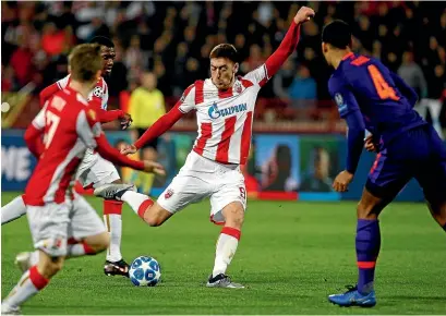  ??  ?? Milan Pavkov scores his second goal in Red Star Belgrade’s 2-0 win over Liverpool yesterday.