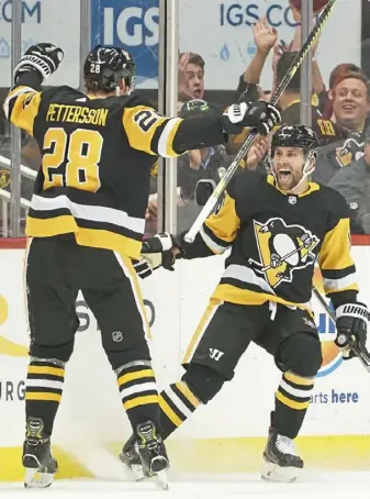  ?? Peter Diana/Post-Gazette ?? Penguins left wing Jason Zucker celebrates his second goal against the Canadiens at PPG Paints Arena. “You can see his ability to finish,” coach Mike Sullivan said.