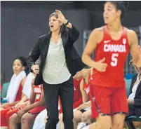  ?? SEAN KILPATRICK THE CANADIAN PRESS ?? Canada’s head coach Lisa Thomaidis leads her players into Saturday’s World Cup in Spain ranked a program-high fifth.