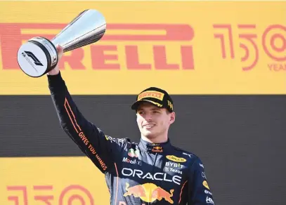  ?? Picture: AFP ?? ANOTHER TROPHY. Red Bull’s Dutch driver Max Verstappen celebrates on the podium after winning the Spanish Formula One Grand Prix at the Circuit de Catalunya in Montmelo yesterday.