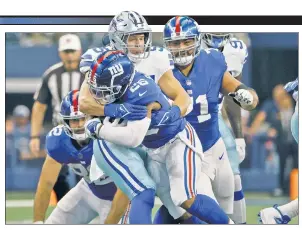  ?? AP; Fox Sports ?? BRUISE CREW: Saquon Barkley is tackled by Leighton Vander Esch during the first half of the Giants’ 44-20 loss to the Cowboys. The running back exited the game in the first quarter after suffering a left ankle injury (below).