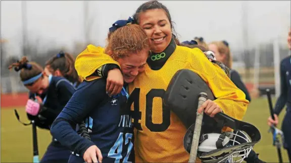  ?? BILL RUDICK — DIGITAL FIRST MEDIA ?? Villa Maria’s Erin Finley, left, is hugged by goalkeeper Danielle Acuna as they celebrate Saturday’s state final victory.