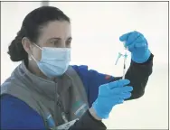  ?? Tyler Sizemore / Hearst Connecticu­t Media ?? Nurse Amy Busch prepares the Pfizer COVID-19 vaccine at the vaccinatio­n clinic at Boccuzzi Park in Stamford on May 13.