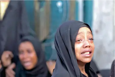 ??  ?? FACE OF TRAGEDY: A girl cries after her father was killed by a Saudi-led air strike in Yemen's capital Sanaa yesterday. Saudi-led air raids killed 21 civilians, including women and children, in Sanaa, two days after the start of a United...