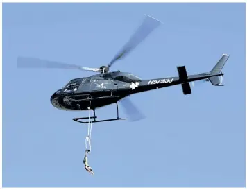  ?? FILE PHOTO ?? In this Oct. 11, 2015 photo, Erendira Vasquez Wallenda hangs from a helicopter.